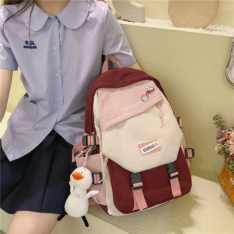 DCIMOR New Waterproof Nylon Women Backpack Female Contrast Color Cartoon Printing Buttoned Travel Bag Teenage Girl Schoolbag